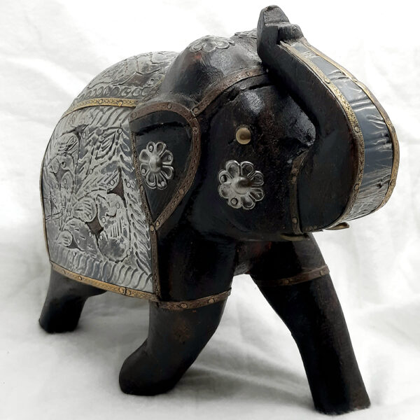 hand sculptured wooden elephant with metal embellishments