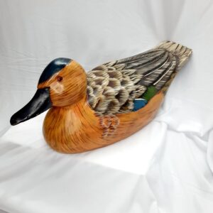 large tan coloured wooden decoy duck