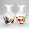 pair of white vases with multi coloured swirl pattern