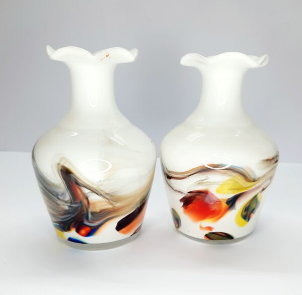 pair of white vases with multi coloured swirl pattern