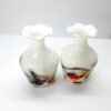 pair of white vases with multi coloured swirl pattern