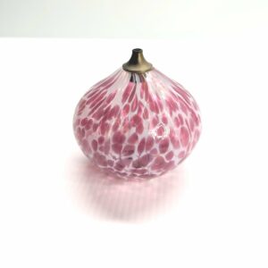 pink and white glass oil burner