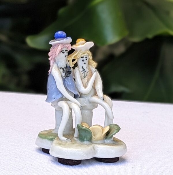 italian spaghetti hair couple figurine