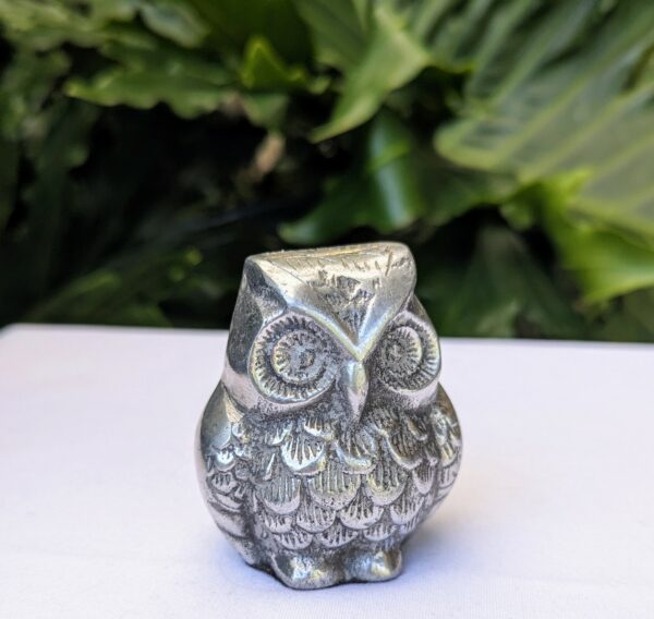 silver metal owl figurine