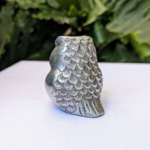 silver metal owl figurine