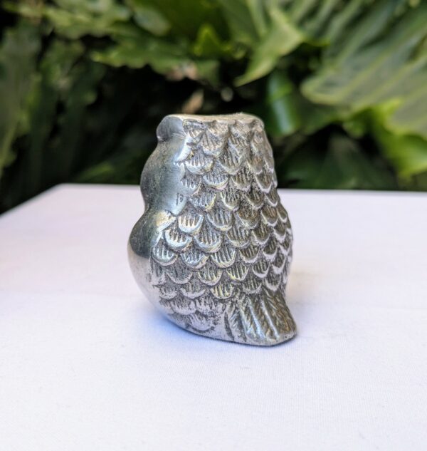 silver metal owl figurine