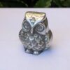 silver metal owl figurine
