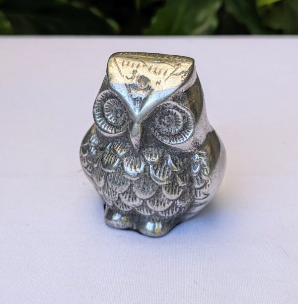 silver metal owl figurine